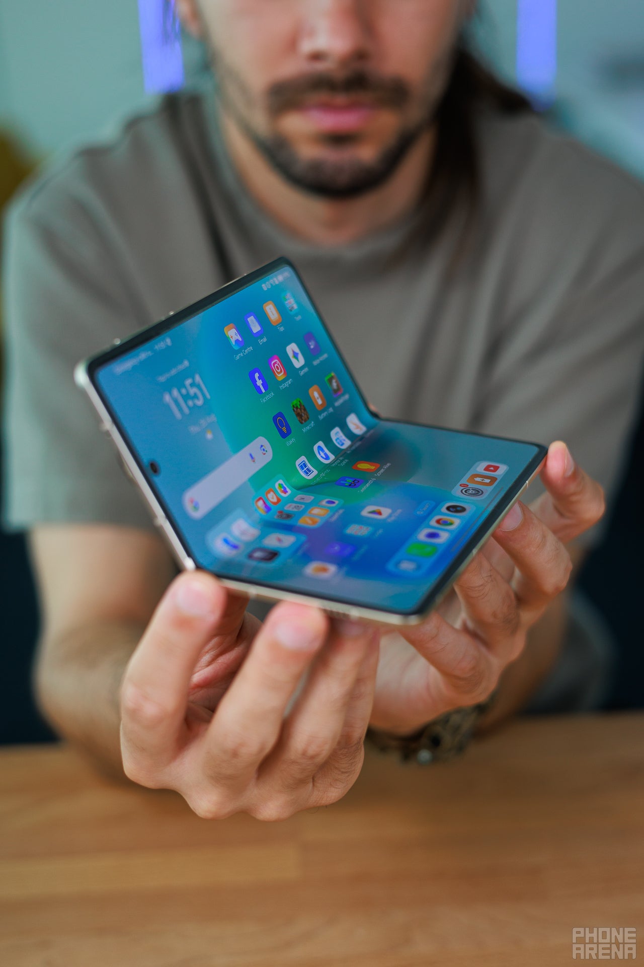 A man holding the Honor Magic V5.