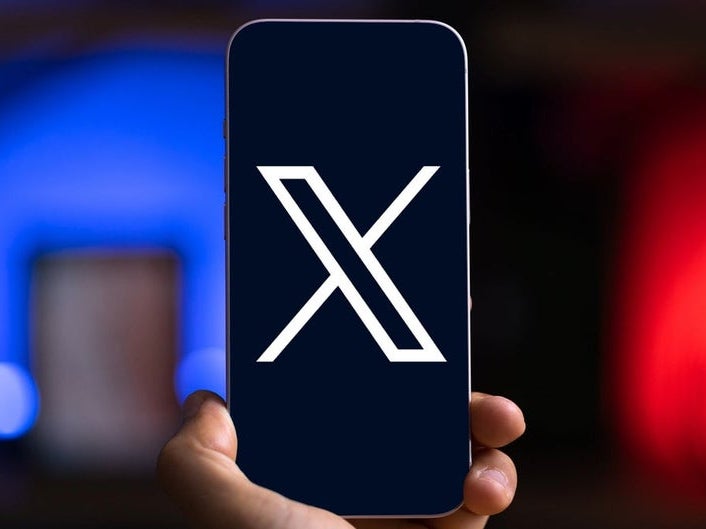 X (formerly Twitter) logo on a phone