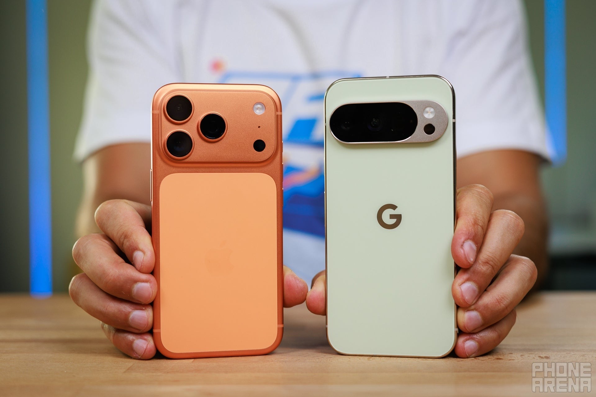 Apple iPhone 17 Pro vs Google Pixel 10 Pro held side by side with backs showing