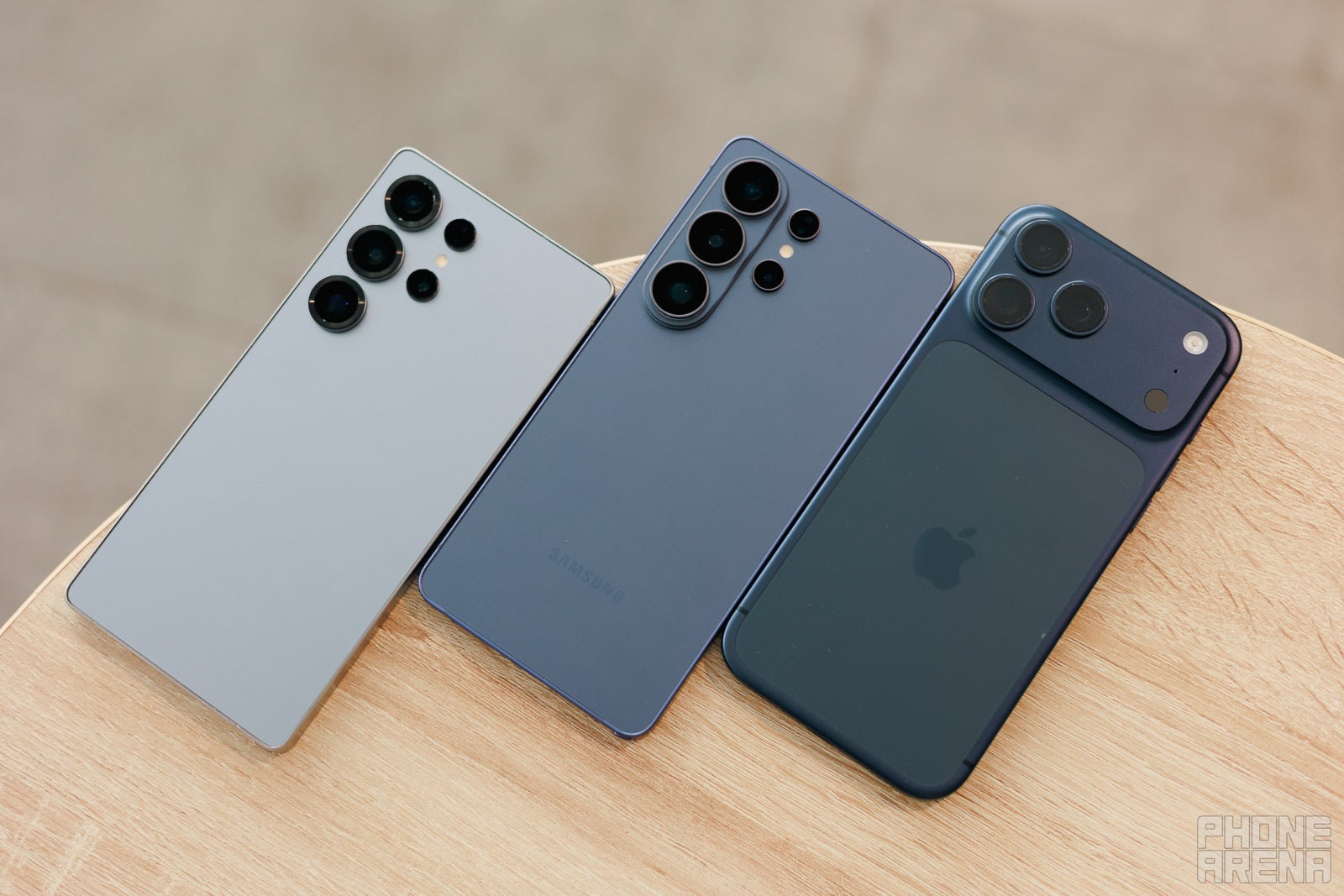 The S26 Ultra is at the center, while the iPhone 17 Pro Max is on the right | Image by PhoneArena - I didn't expect to love the Galaxy S26 Ultra design this much, but here is what still bugs me