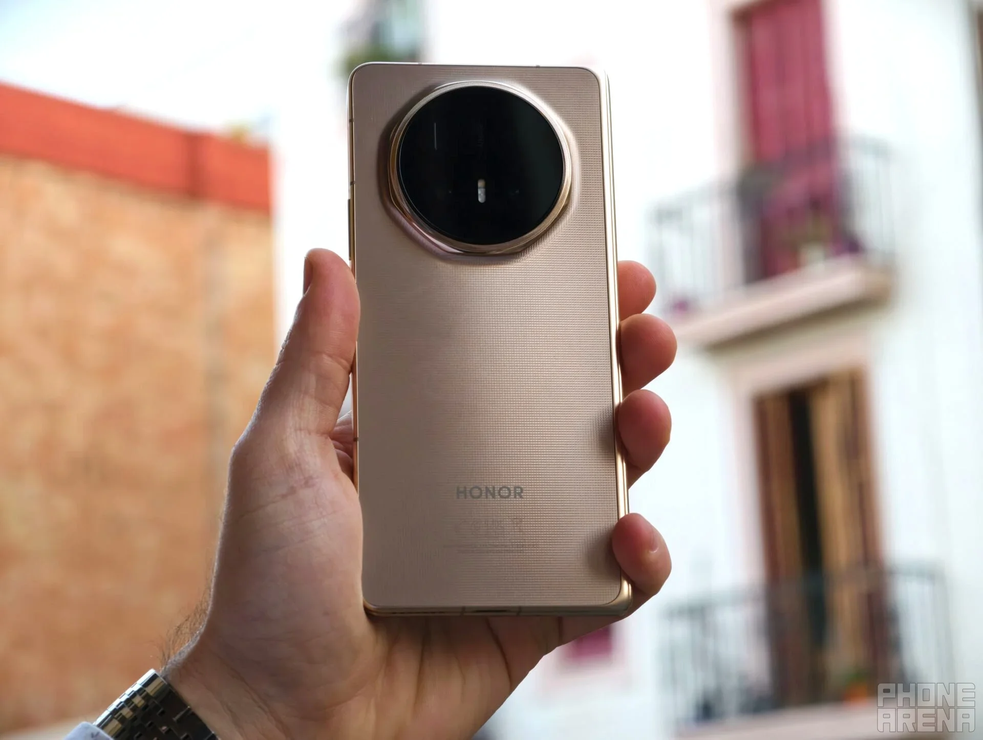 Honor phone held in hand.