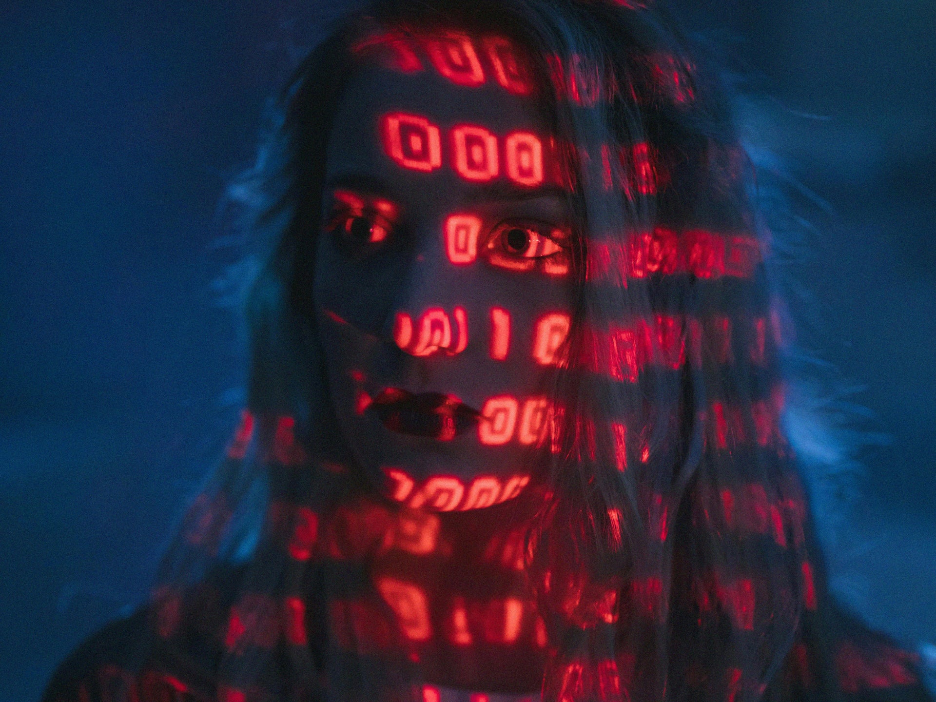 Woman with red numbers over face.