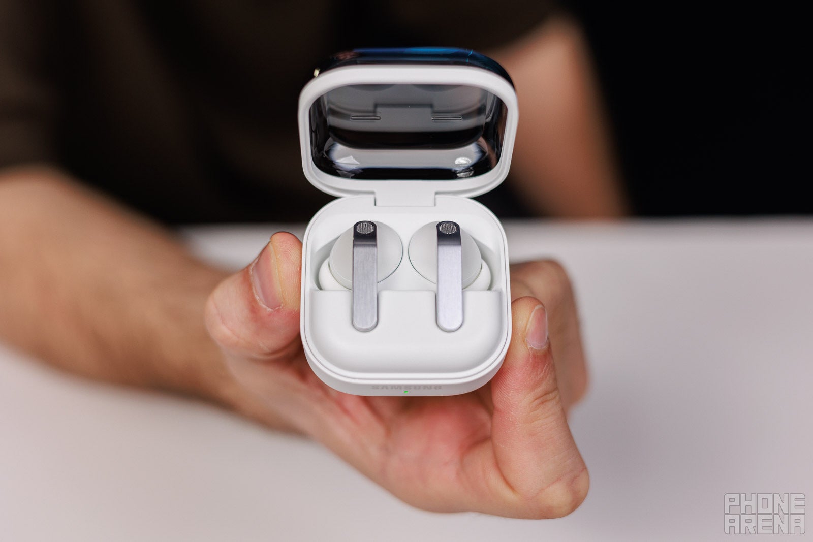 The Galaxy Buds 4 are proving to be yet another Samsung success story. | Image by PhoneArena - The new Samsung must-have has reportedly doubled last year's launch