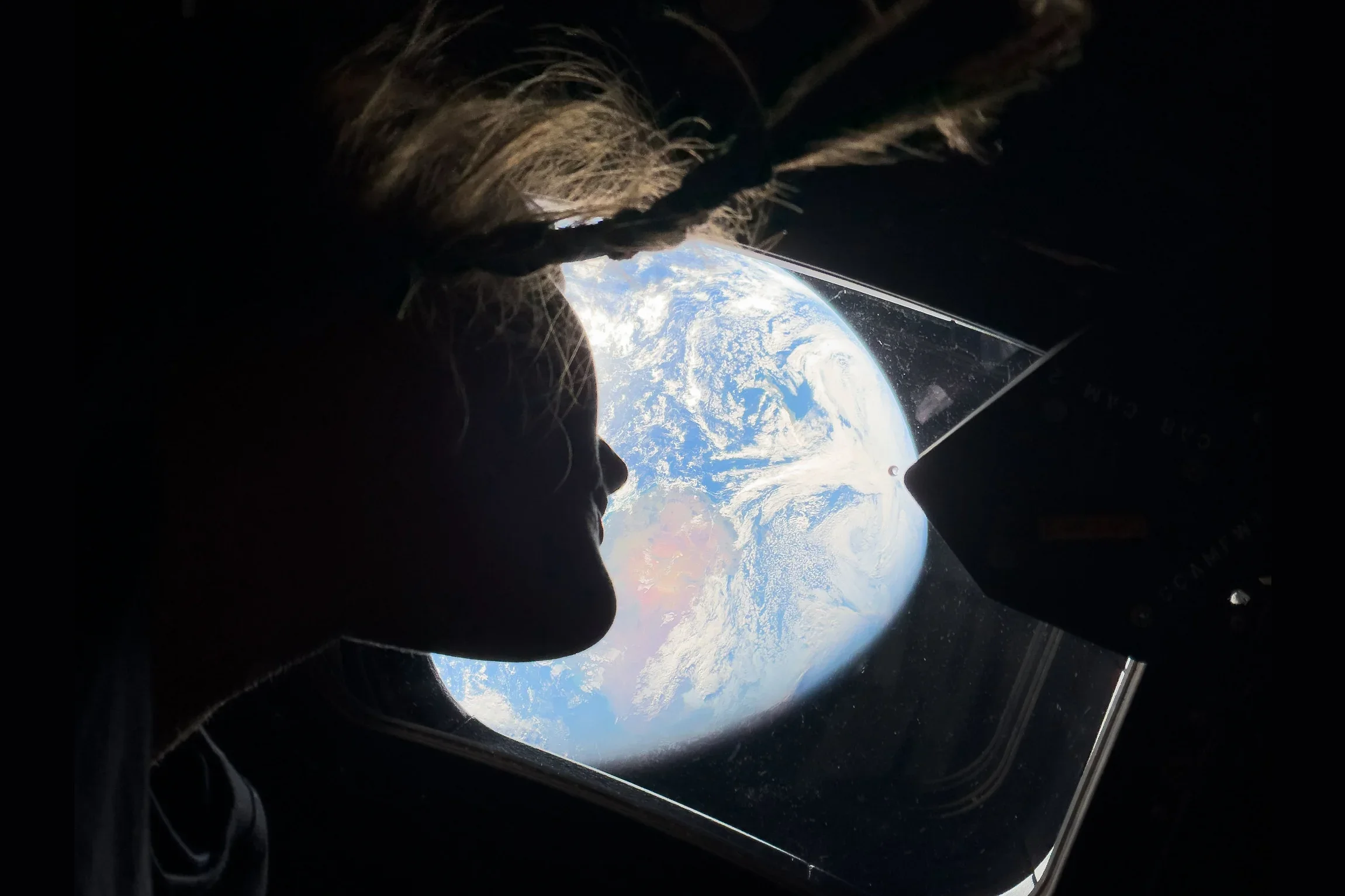 Selfie taken from space with planet Earth in the background. | Image by NASA - It took 200 days and 695,081 miles for the iPhone 17 Pro Max to shine brighter than ever