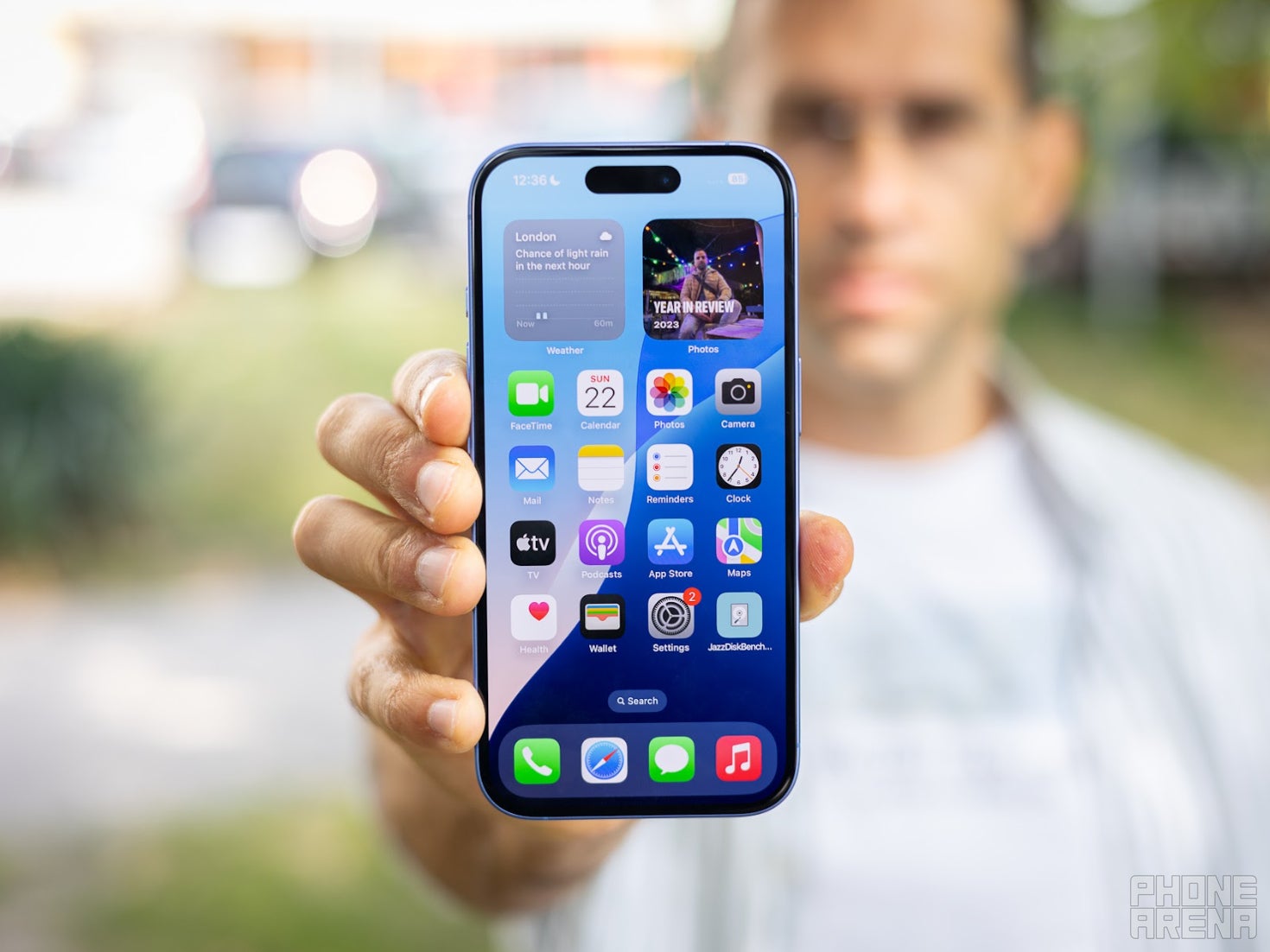 Holding up an iPhone 16 Pro