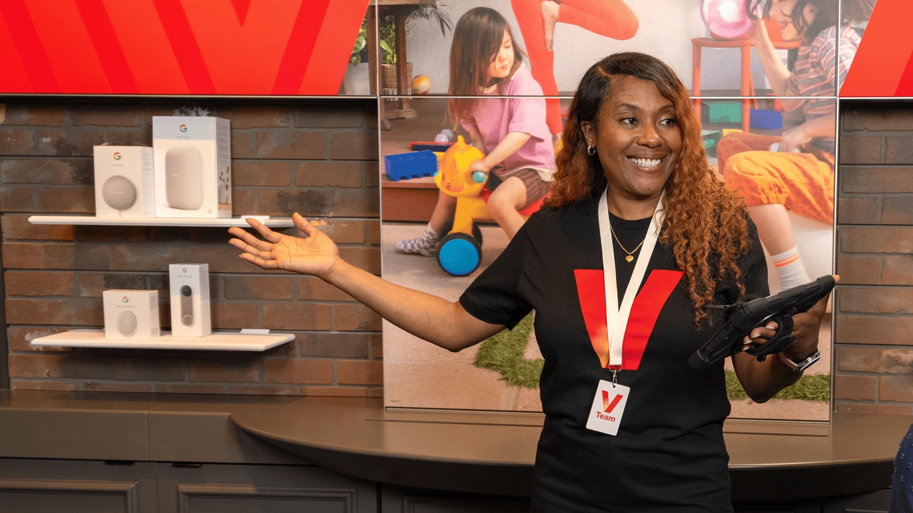 Picture shows Verizon rep inside a store.