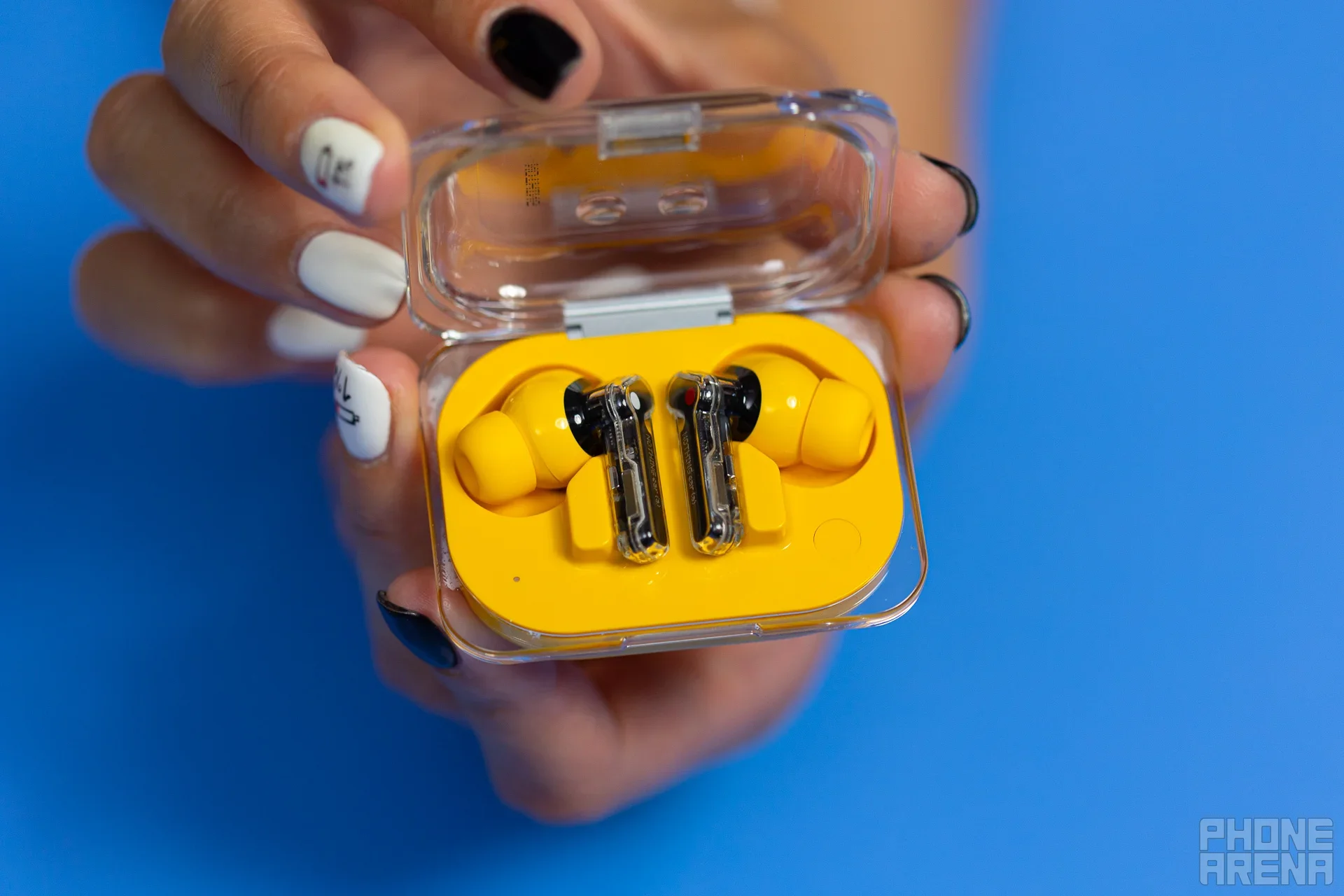 You don't see bright yellow earbuds every day! | Image by PhoneArena - The Nothing Ear (a) earbuds are nothing but a great deal at 33% off