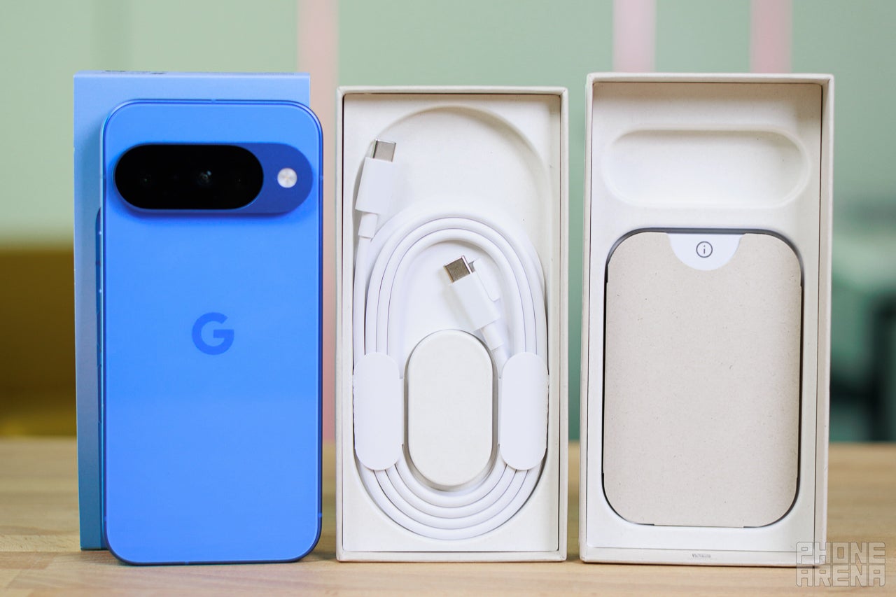 Google Pixel 10 beside its box and a USB-C charging cable