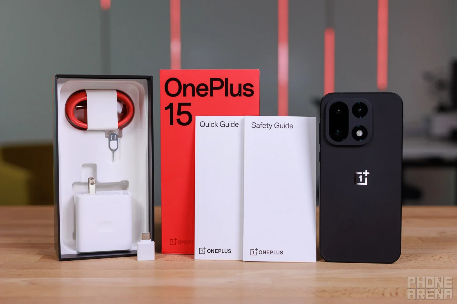 OnePlus 15, and the contents of the box.