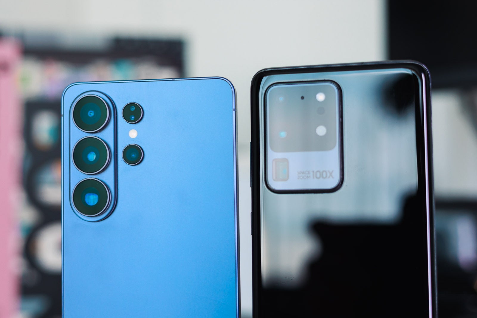 A blue and a black Galaxy S Ultra phones, closeup.