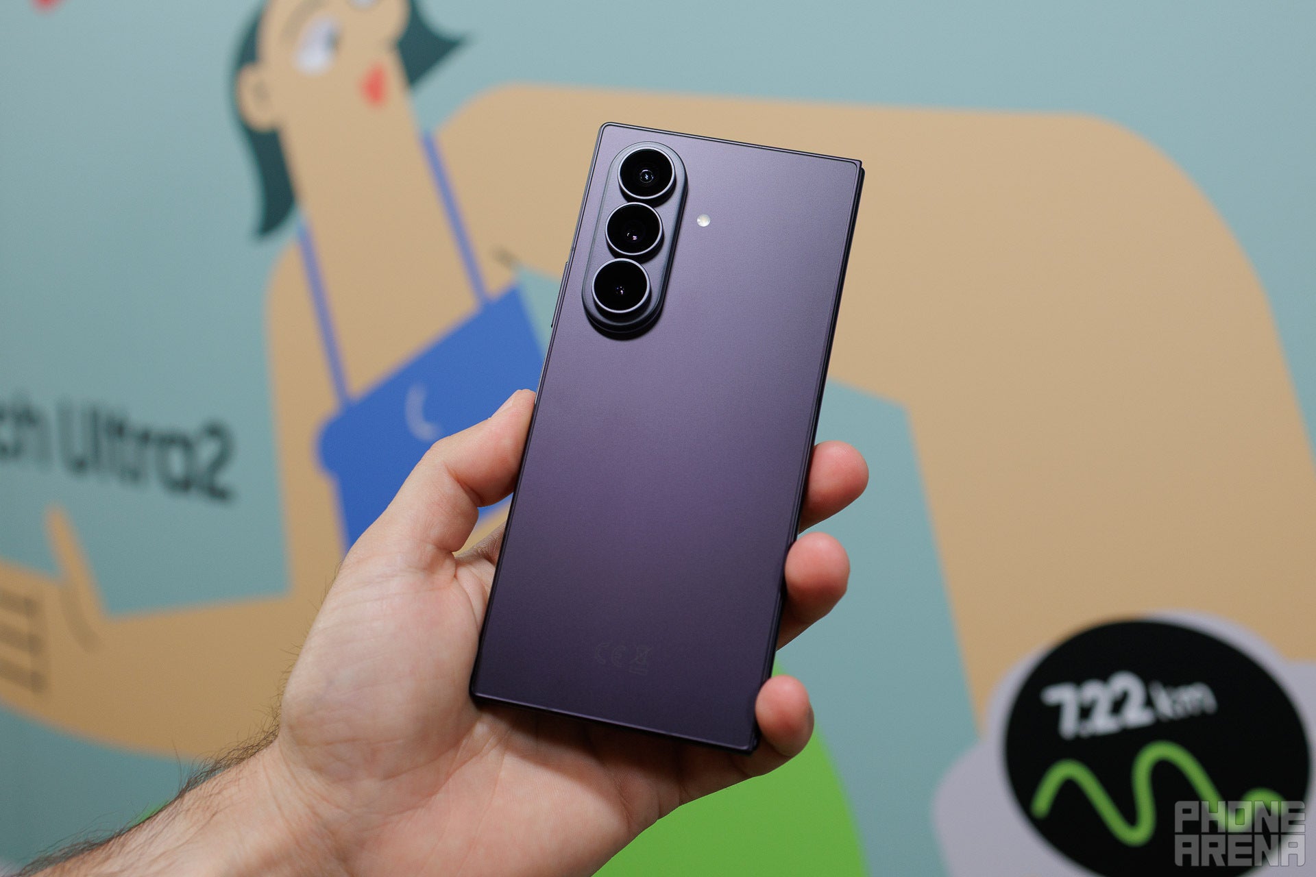 Galaxy Z Fold 8 Ultra held folded, showing its triple camera
