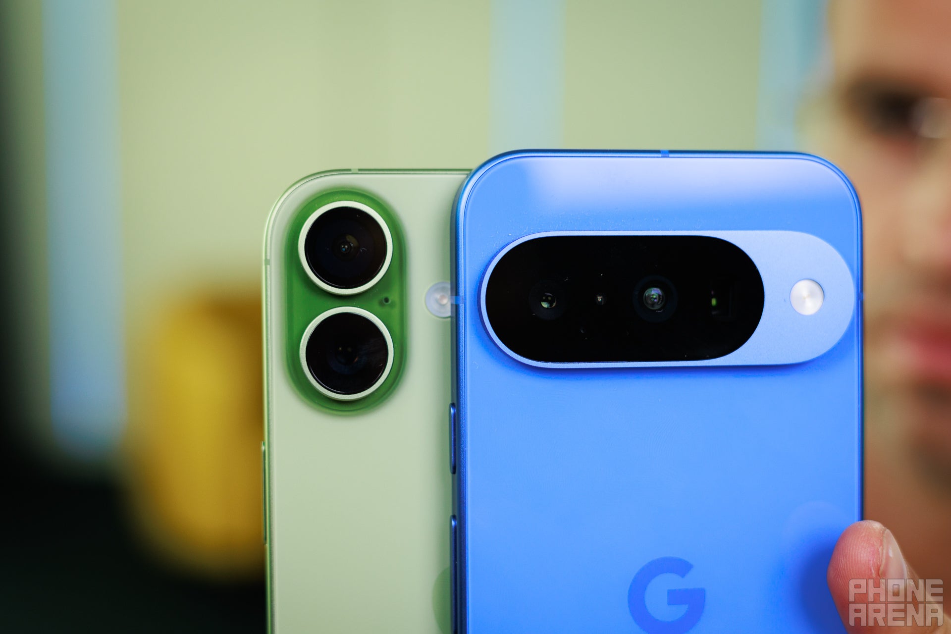 Rear camera setup of Pixel 10 and iPhone 17.