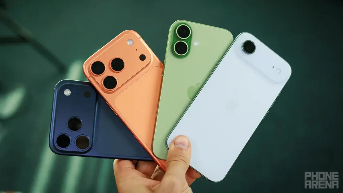 Several iPhone held in hand.