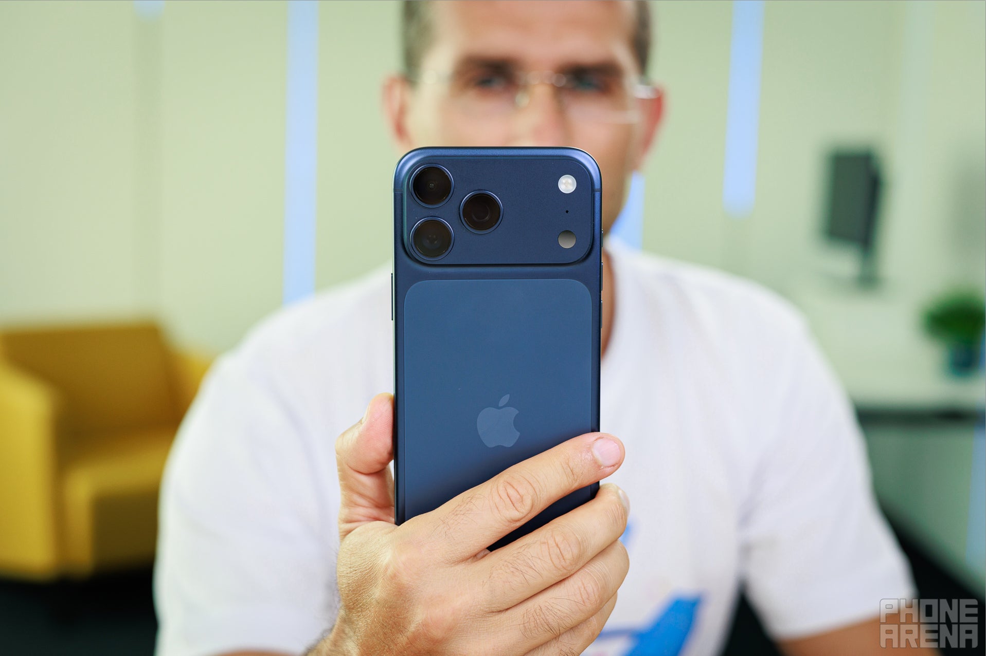 iPhone 17 Pro Max in deep blue held in hand