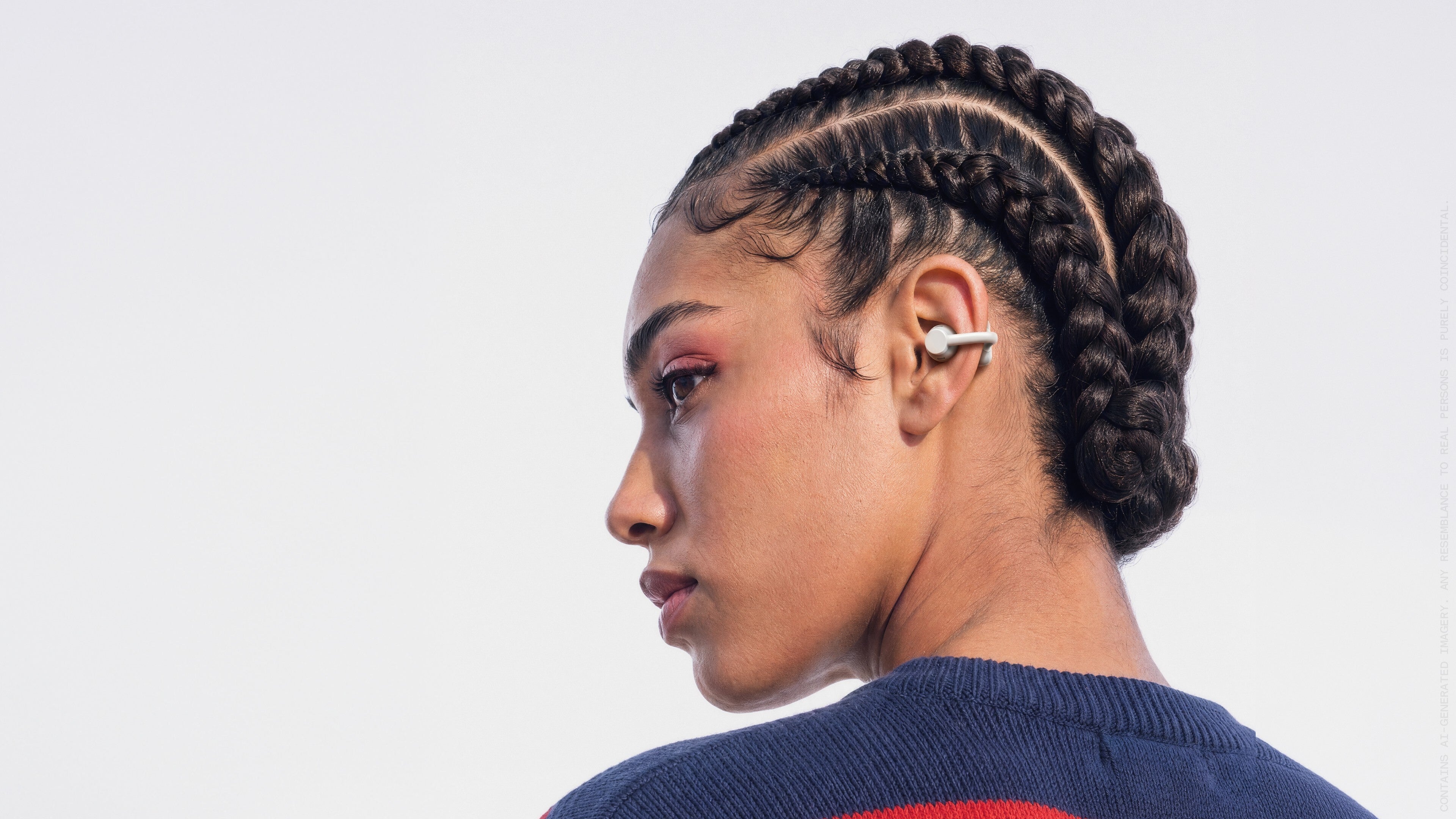 A woman with earbuds.