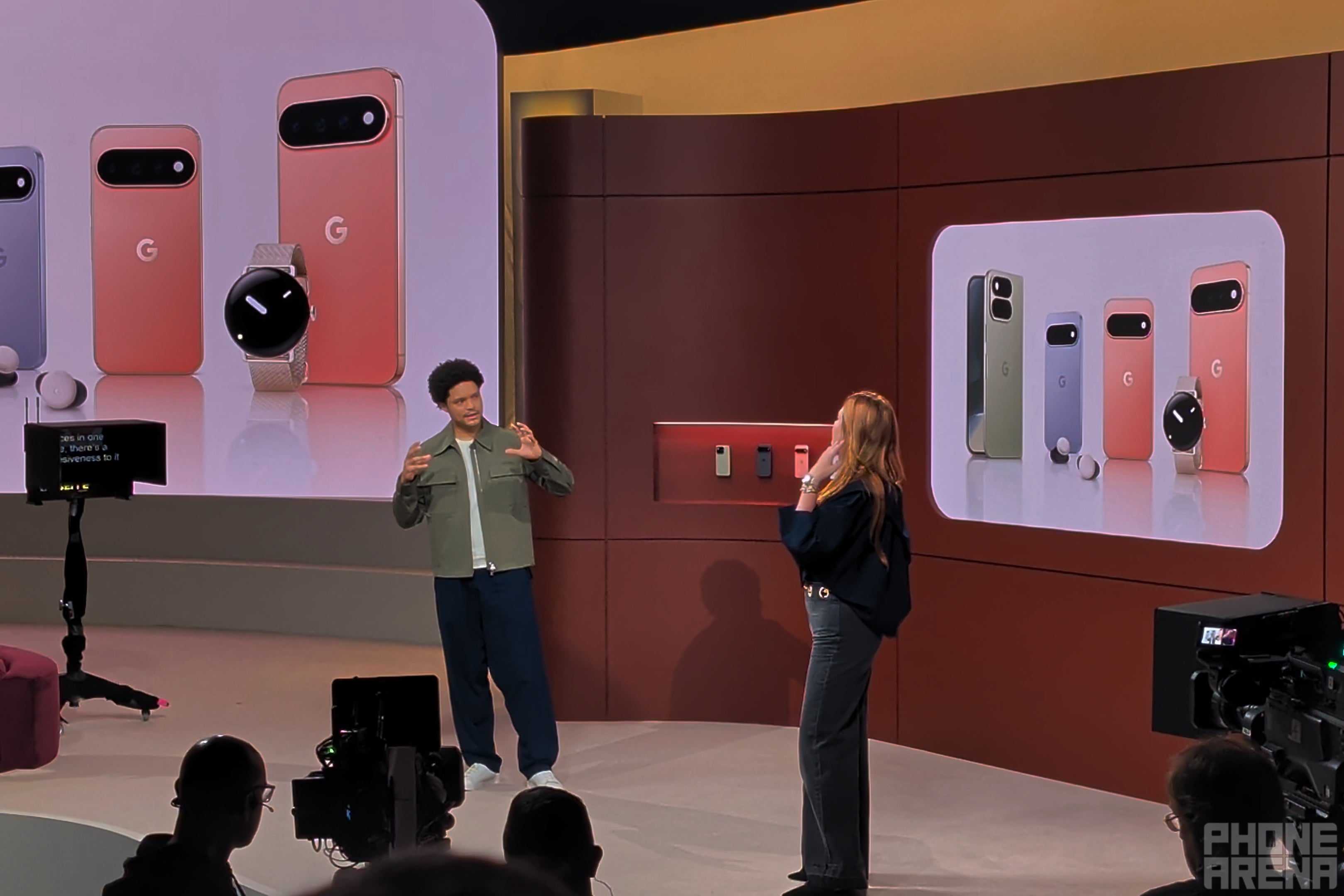 Trevor Noah on stage with a presenter and the Pixel 11 lineup.