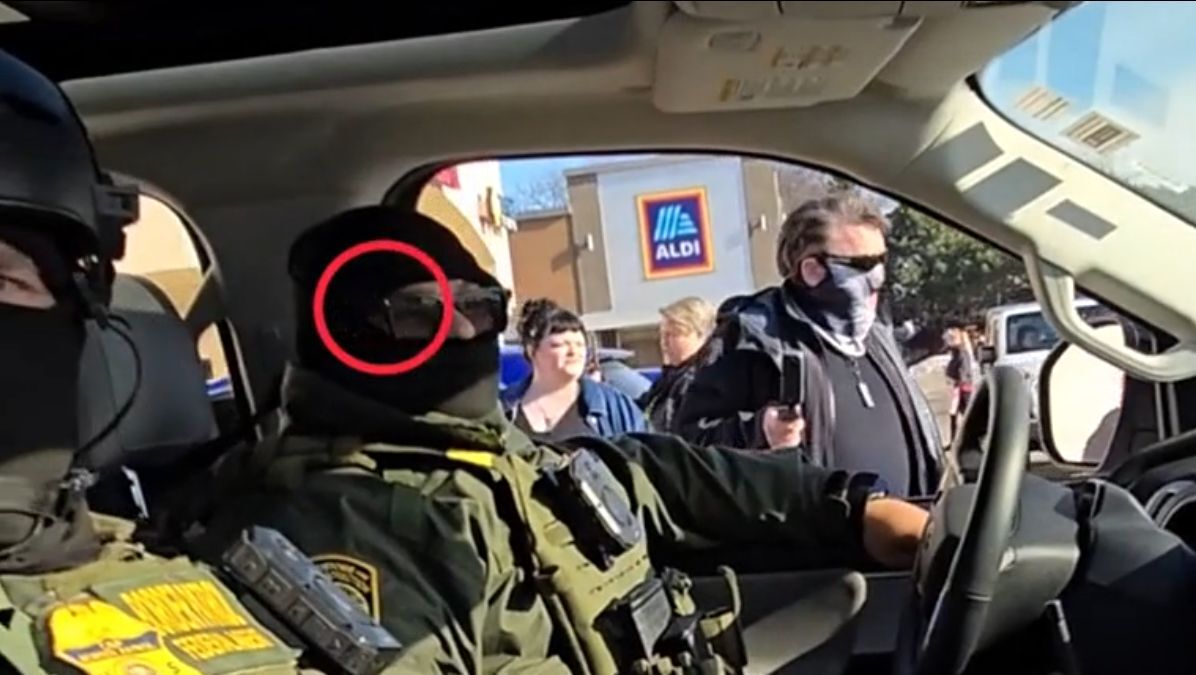 DHS agent using Meta's smart glasses to record protesters. | Image by The Independent - ICE agents are wearing Meta glasses on duty&mdash;and the agency isn't happy about it