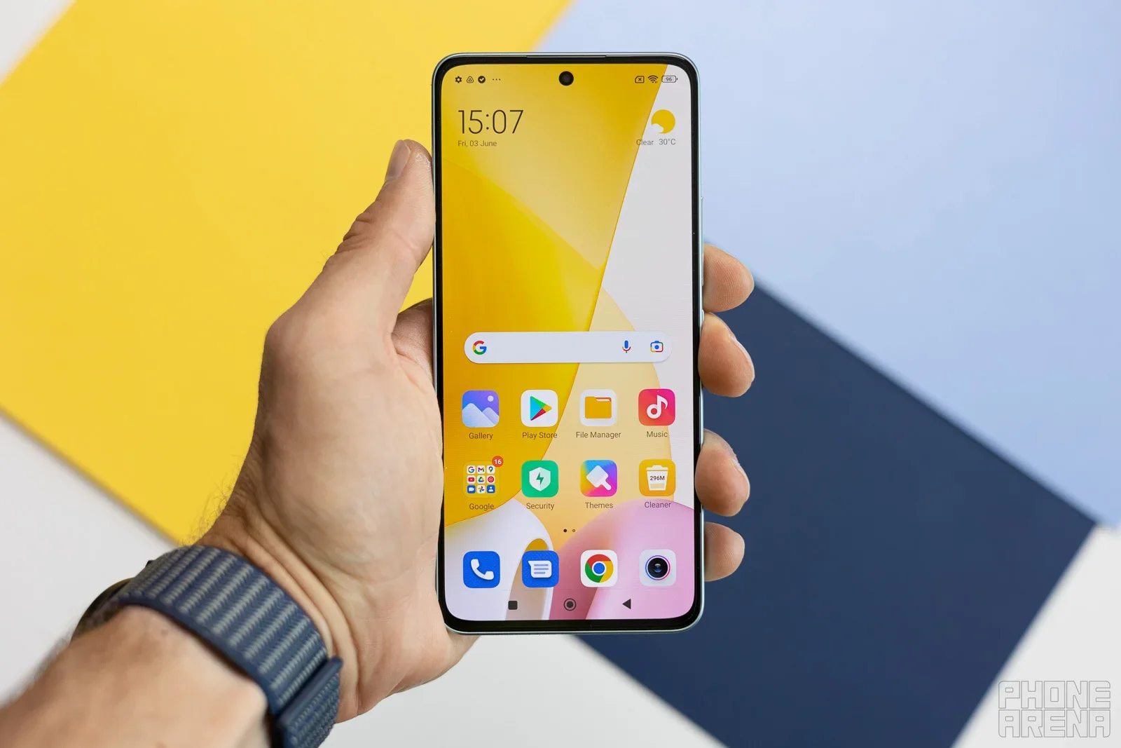 Xiaomi phone in hand.