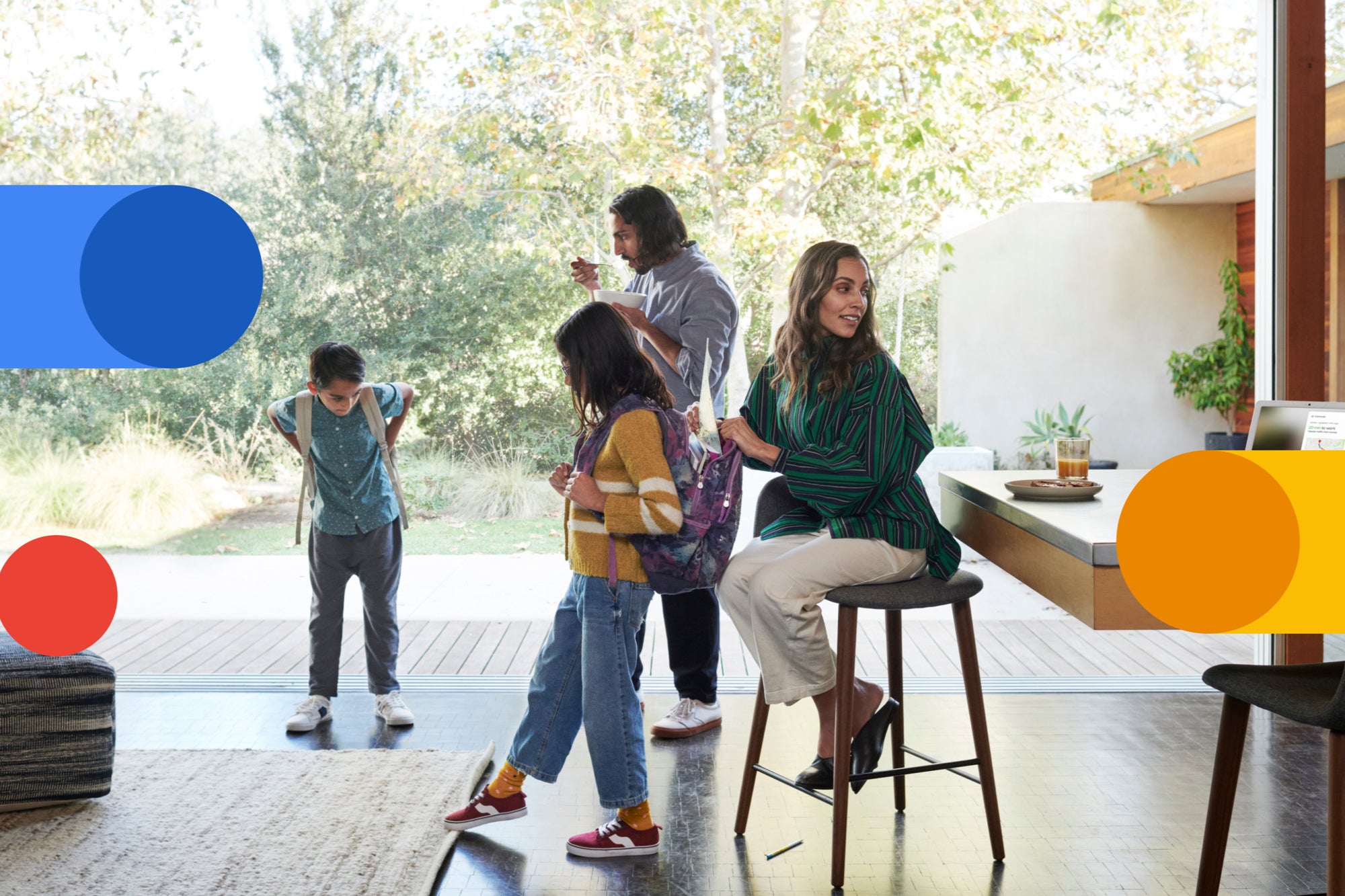 Family with backpacks at home beside Google Fi color shapes.