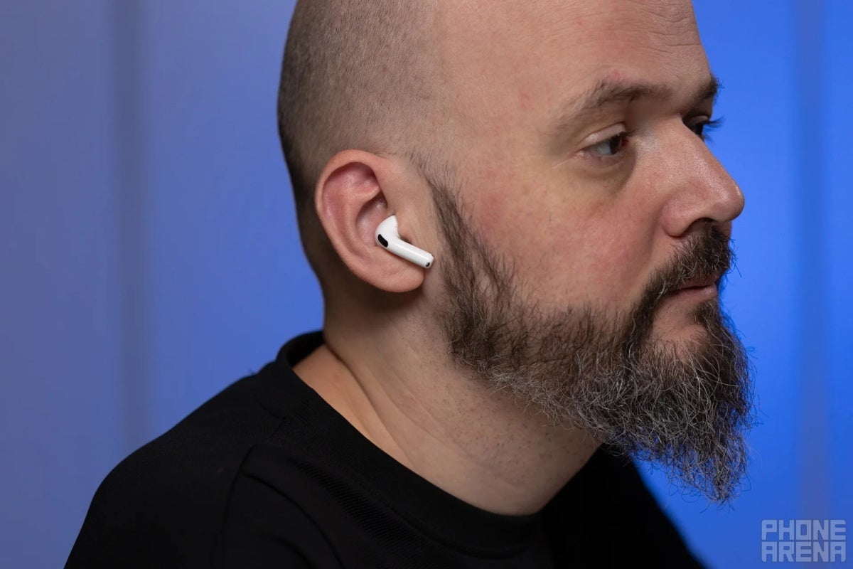 Apple AirPods 4 in a user&amp;#039;s ear