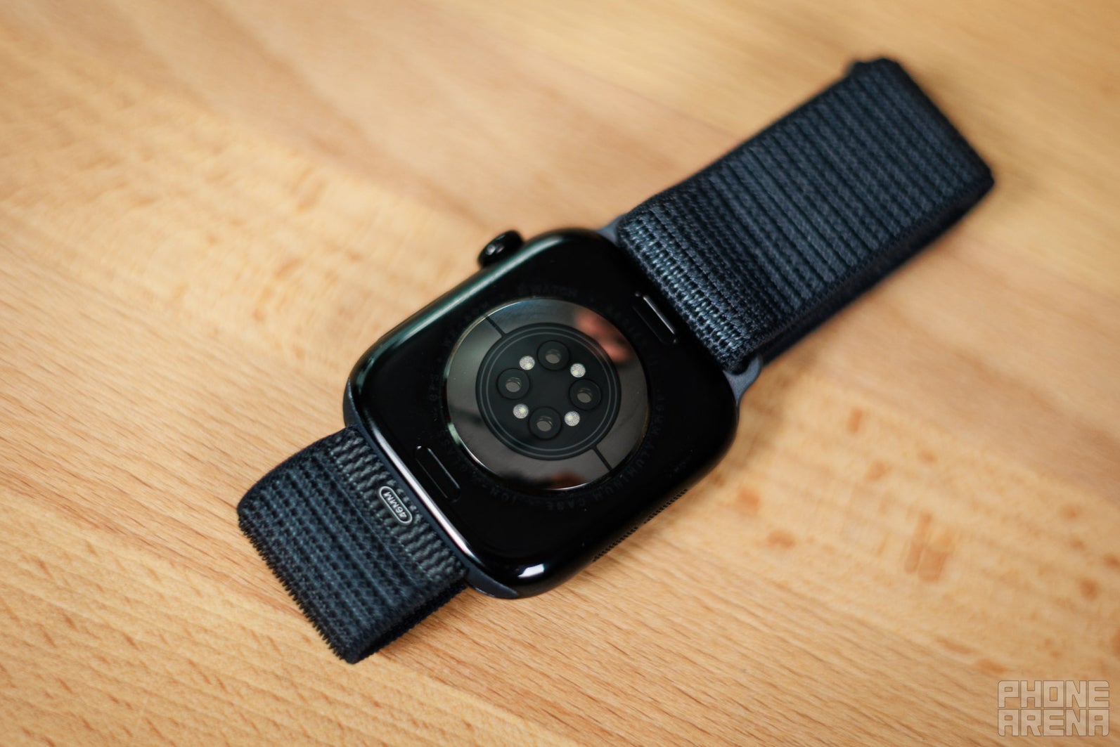 Back of an Apple Watch Series 11 showing its heart rate sensor array