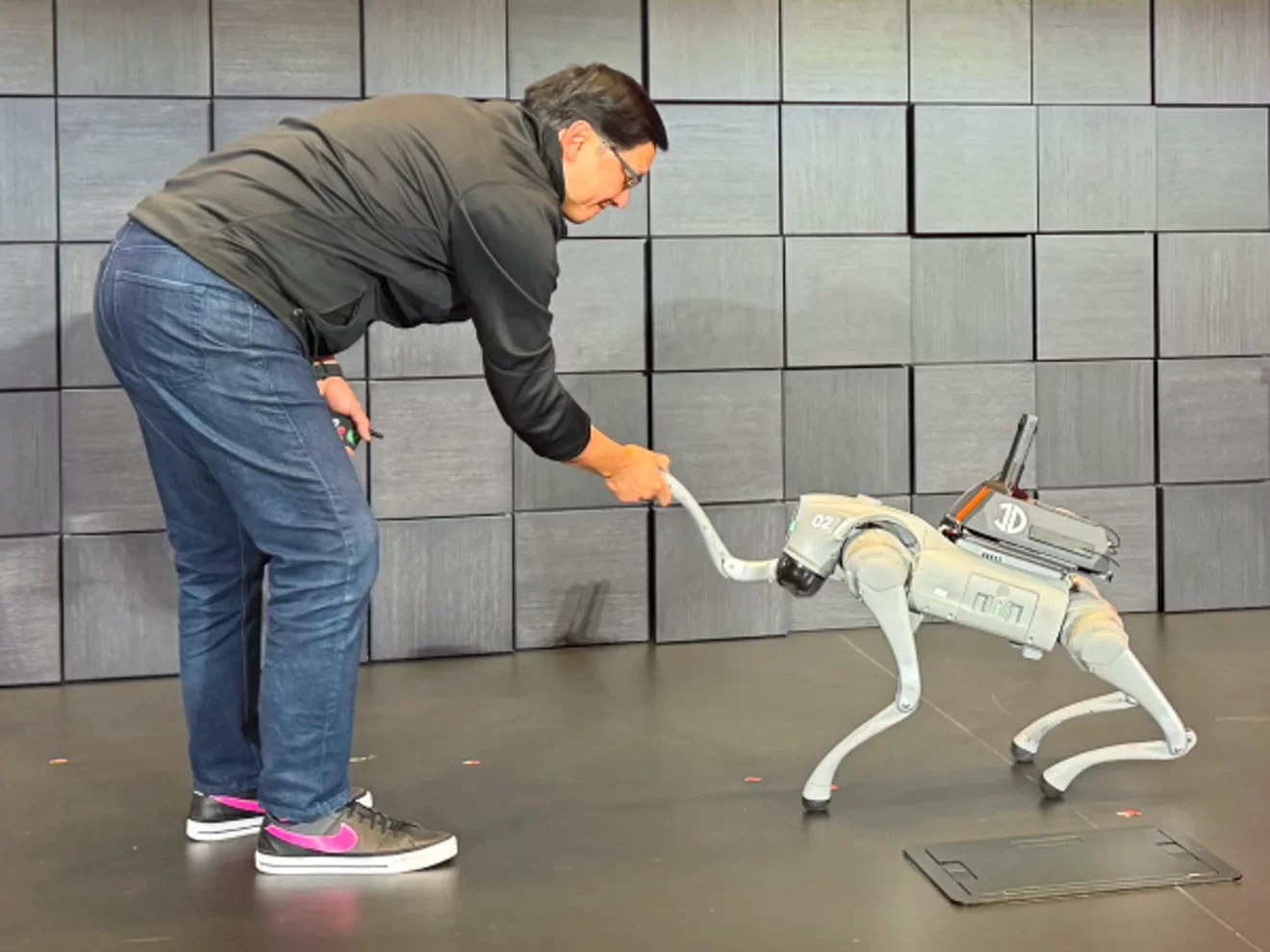 Picture of T-Mobile CTO John Saw and a robotic dog.