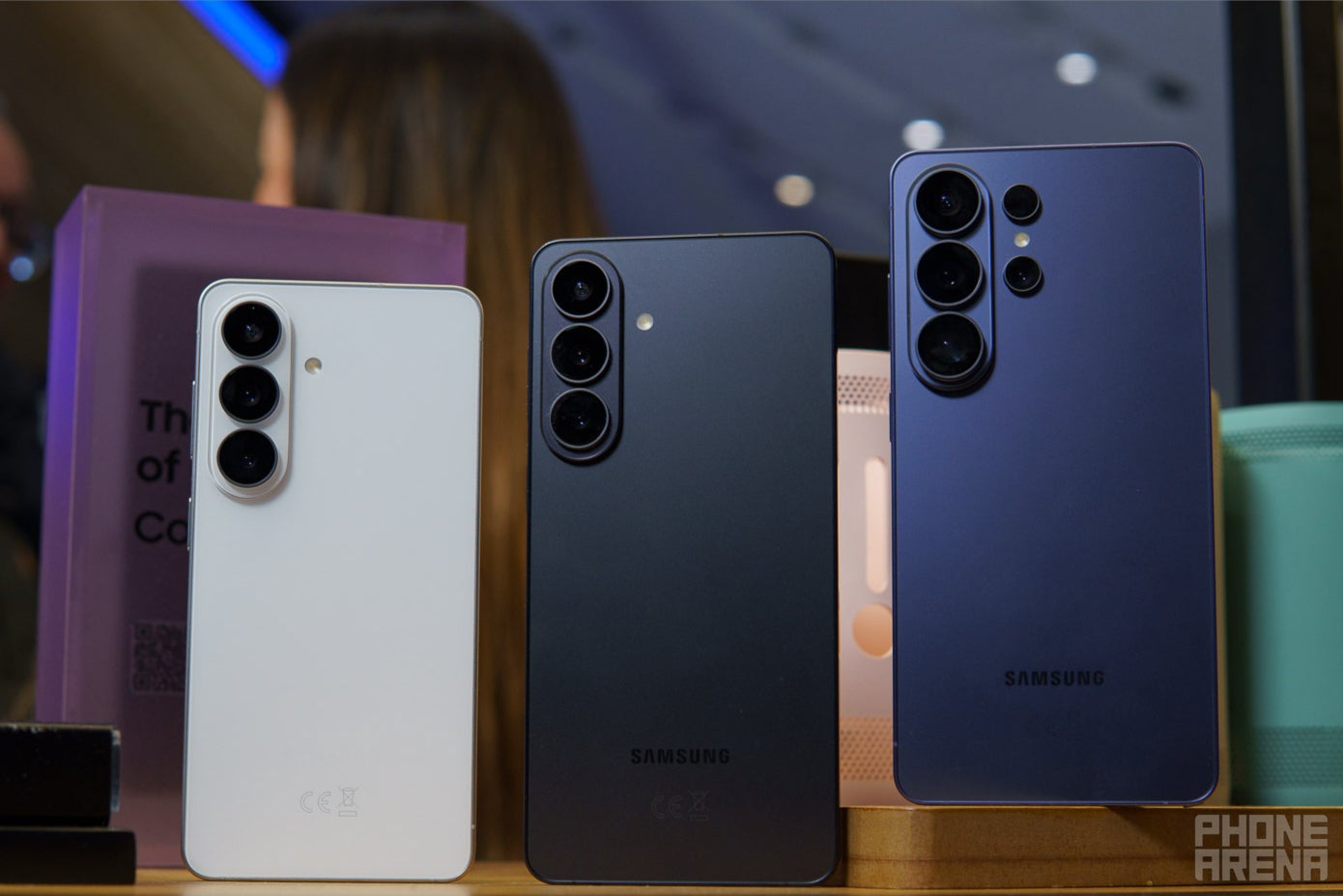 Galaxy S26 Ultra, S26+, and S26 lined up from the back on a wooden table