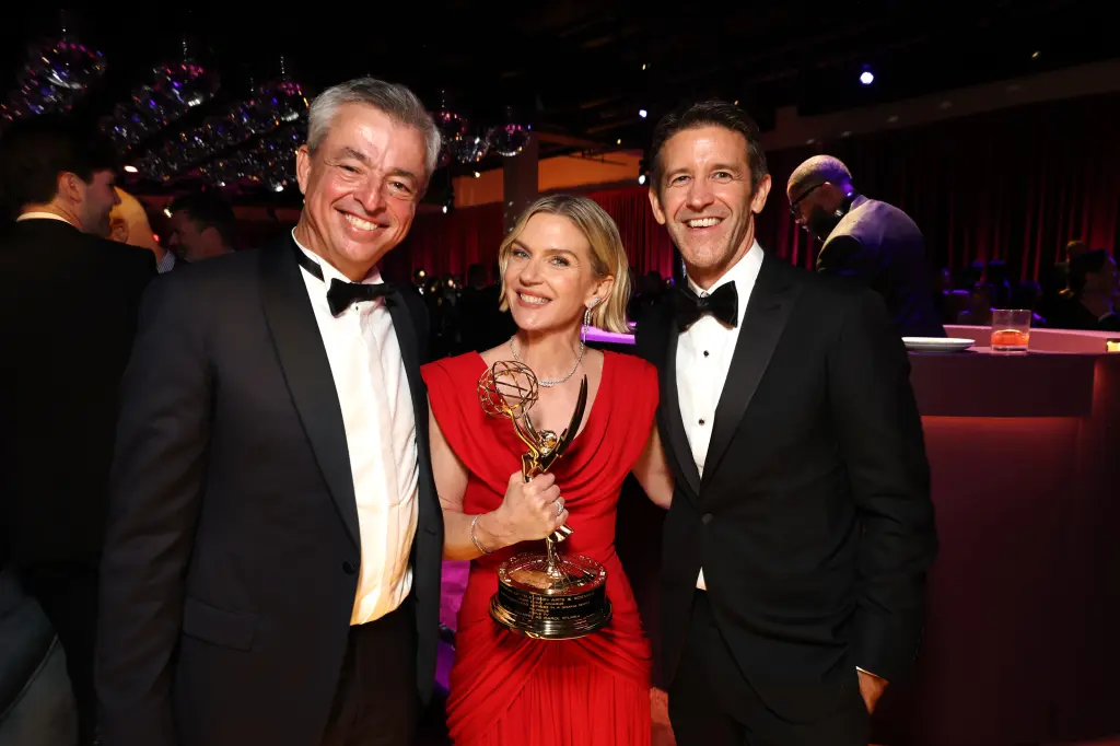 John Ternus with Pluribus duo Rhea Seahorn and Vince Gilligan. | Image by Page Six - iPhone Duo appears at the Emmy Awards, Hollywood stars beg new Apple CEO for one