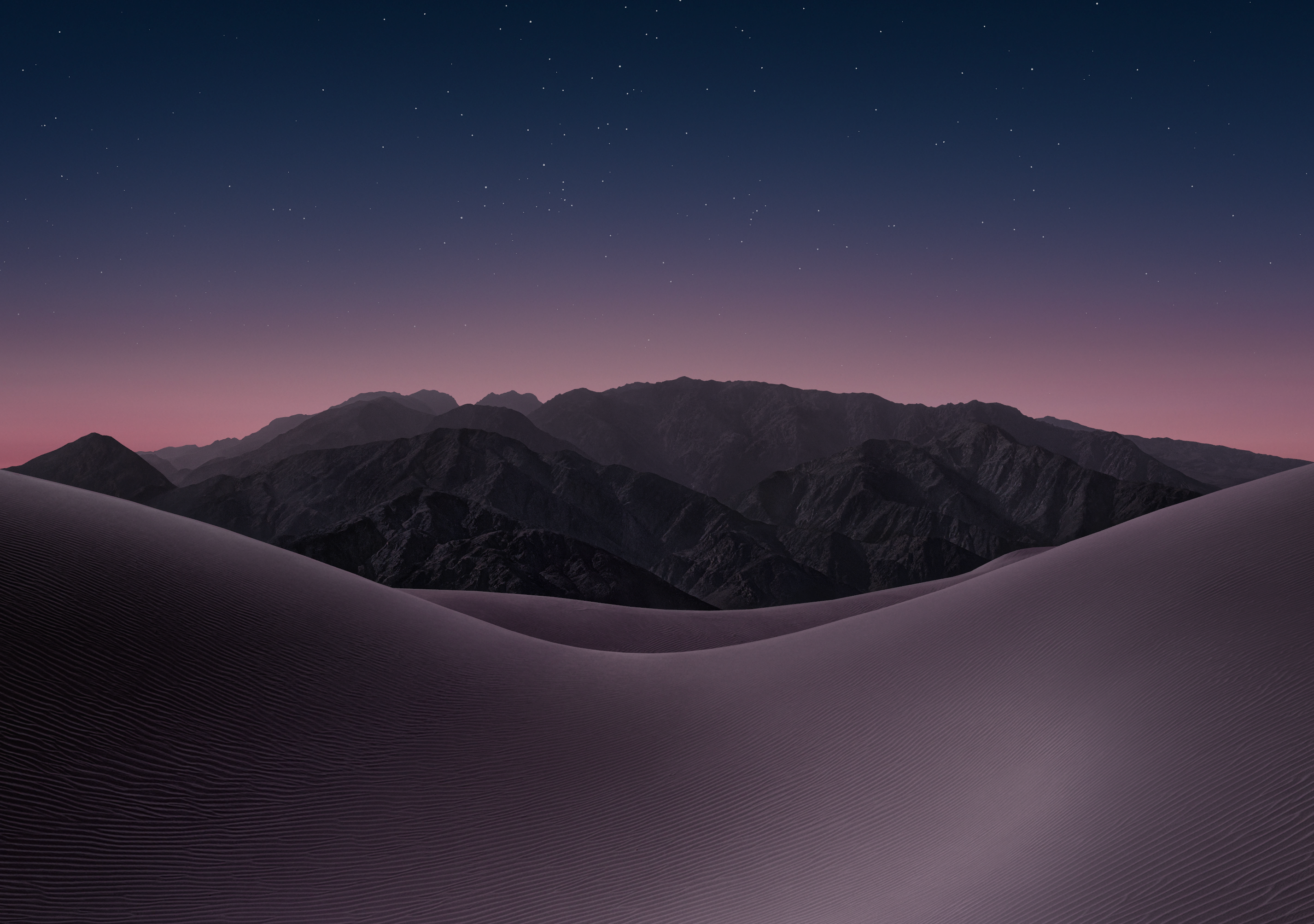 iPhone Duo dark mode wallpaper 2. | Image by Apple - Download a taste of the iPhone Duo here