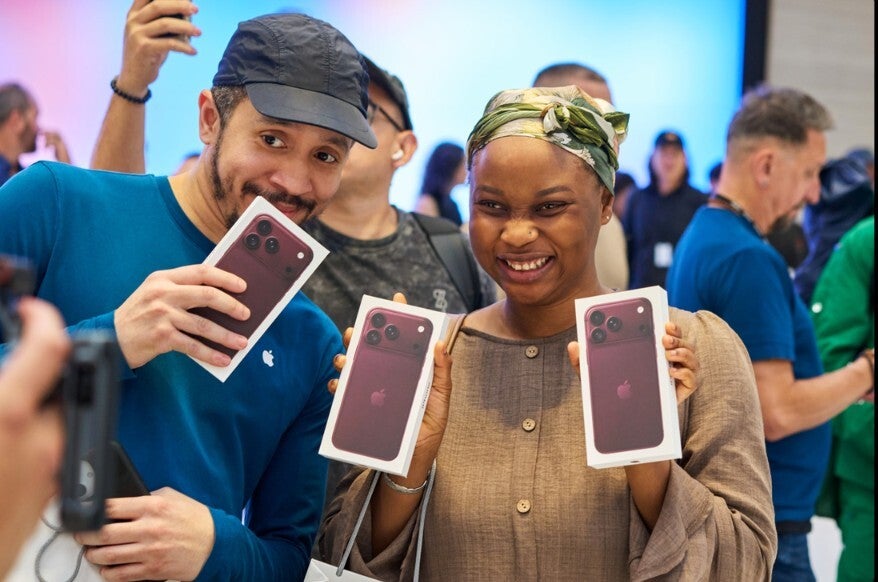 Customers picking up their new iPhone 18 Pro phones at NYC Apple Store.