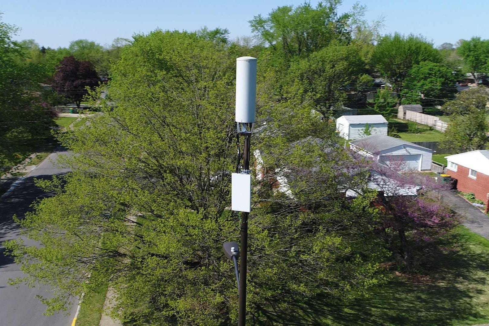 Verizon 5G small cell mounted on a neighborhood streetlight pole