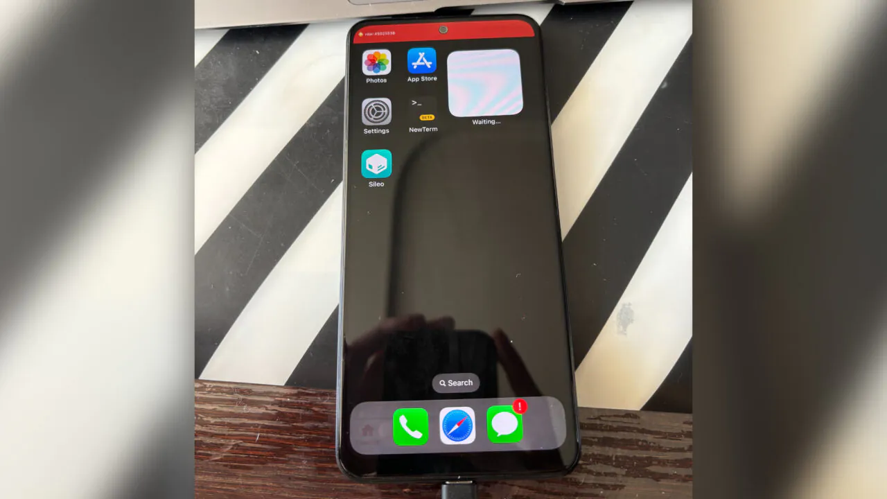 The iOS home screen looks surreal on an Android device. | Image by Android Authority - The impossible happened: Someone successfully booted iOS on an Android device