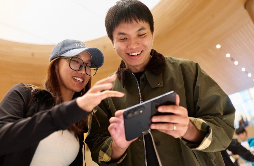 Customers of the Apple Store&amp;nbsp;Jing'an in Shanghai&amp;nbsp;celebrate the release of the iPhone Duo. |&amp;nbsp; Image by Apple - Apple Stores come alive as visitors check out (and checkout) the iPhone Duo, which receives iOS 27.1