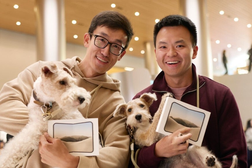 In China, a pair of iPhone Duo handsets get rung up. | Image by Apple - Apple Stores come alive as visitors check out (and checkout) the iPhone Duo, which receives iOS 27.1