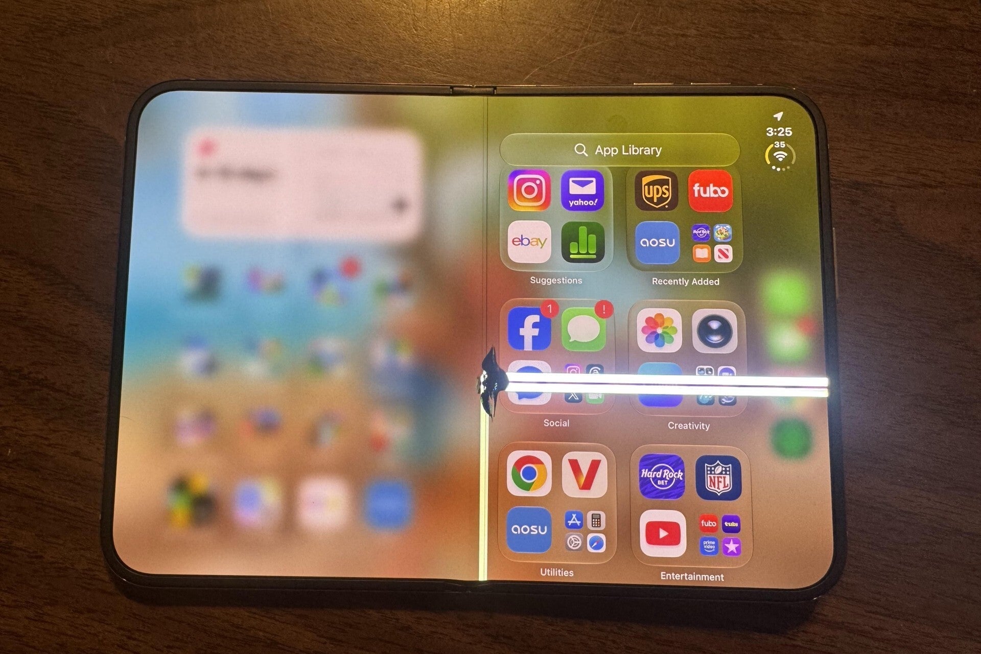Cracked iPhone Duo display with bright vertical lines