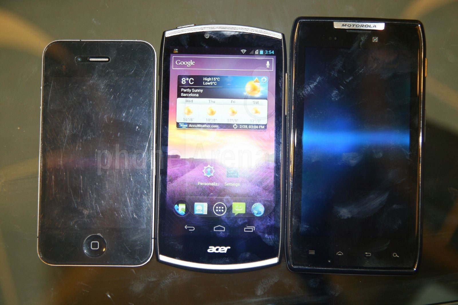 Left to right - Apple iPhone 4, Acer CloudMobile, Motorola DROID RAZR - Acer CloudMobile Hands-on Review