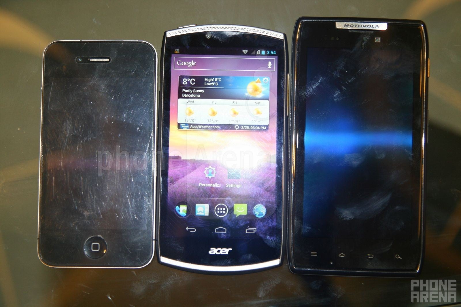 Left to right - Apple iPhone 4, Acer CloudMobile, Motorola DROID RAZR - Acer CloudMobile Hands-on Review