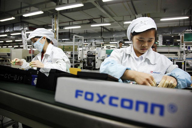 Foxconn employees at work - Report says Foxconn March revenue rose 29.7%