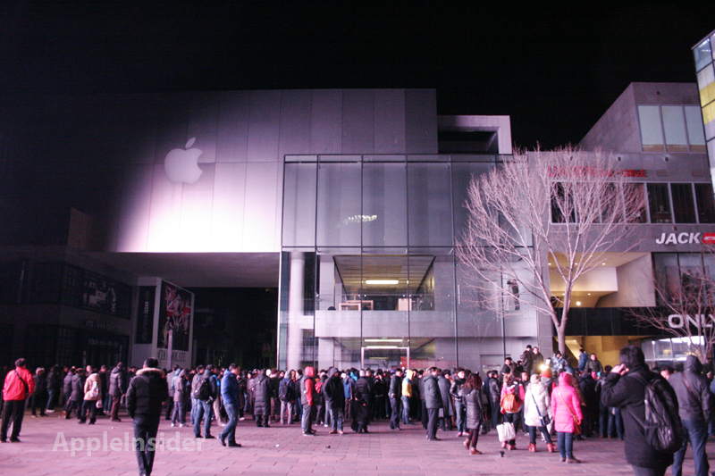A large and unruly crowd outside an Apple Store in Beijing during the launch of the Apple iPhone 4S - Apple implements anti-scalping rules in China prior to launch of third-generation Apple iPad