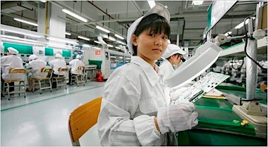 A Foxconn factory worker - Foxconn workers go on strike to protest working conditions while assembling the Apple iPhone 5