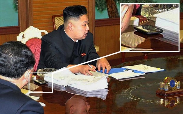 Image courtesy of AFP/Getty Images - Kim Jong-Un&#039;s mysterious phone: not a Samsung, but what is it?