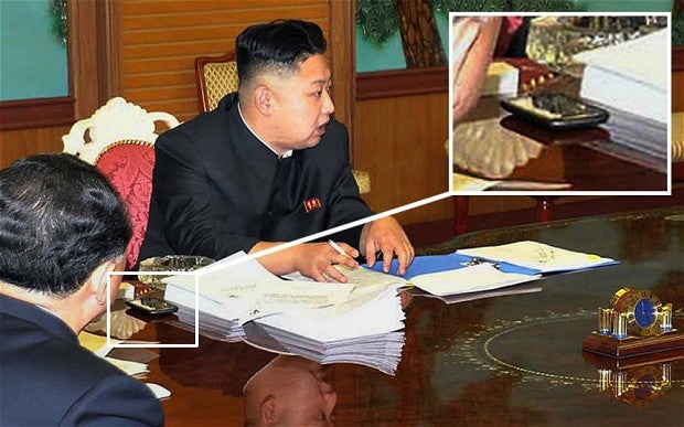 Image courtesy of AFP/Getty Images - Kim Jong-Un's mysterious phone: not a Samsung, but what is it?