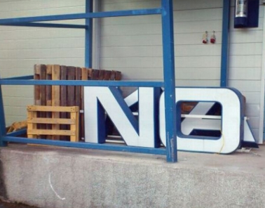 The Nokia sign gets taken down off another building - Nokia sells more real estate to raise cash