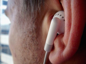 Is this Apple iPod listener damaging his hearing? - Mayor Bloomberg turns his attention from large sodas to Apple's earbuds