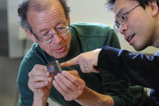 Engineers Arto Nurmikko and Ming Yin examine their prototype wireless, broadband neural sensing device.	 Credit - Fred Field for Brown University - Beyond the touchscreen: voice, gestures, mind control?