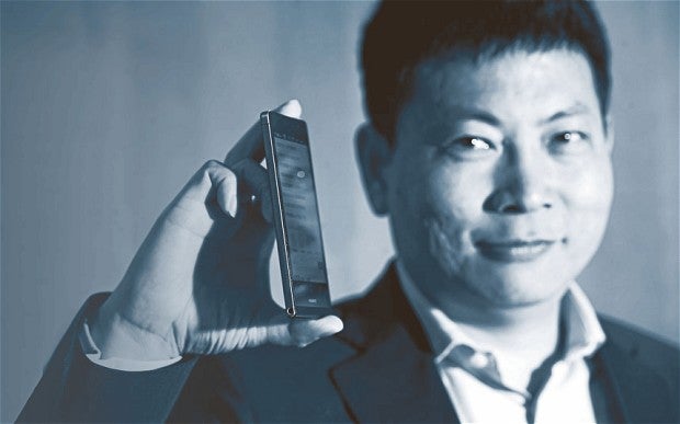 Huawei CEO Richard Yu holding the world's slimmest smartphone the Ascend P6 - Huawei CEO: since the S4 is a 'so-so smartphone' and Apple is 'slipping,' we can be third by 2015