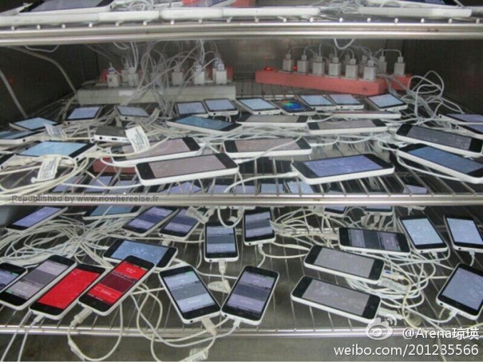 Is this picture showing a us a bunch of plugged-in Apple iPhone 5C units at Pegatron? - Picture shows Apple iPhone 5C units getting tested at the factory