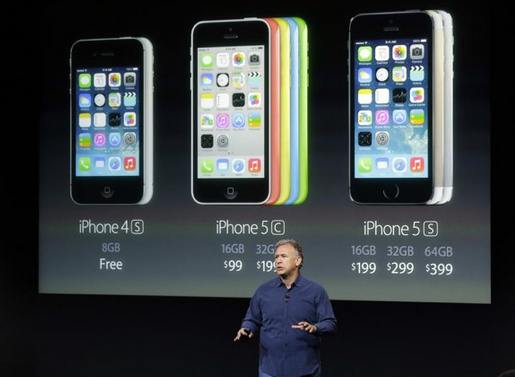 Apple&#039;s Philip Schiller stands in front of pricing information for Apple&#039;s new line up - Investors dump Apple shares, wanting a lower price for the Apple iPhone 5C