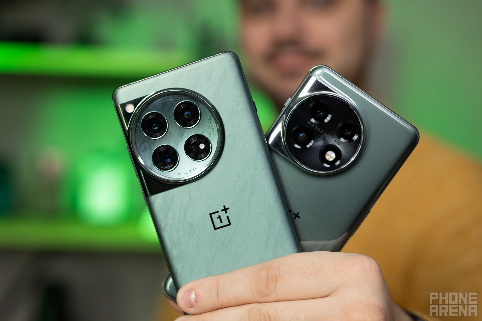 The circular cameras of OnePlus 12 and OnePlus 11 (Image credit - PhoneArena) - OnePlus 13 release date predictions and its pricing, features, and specs