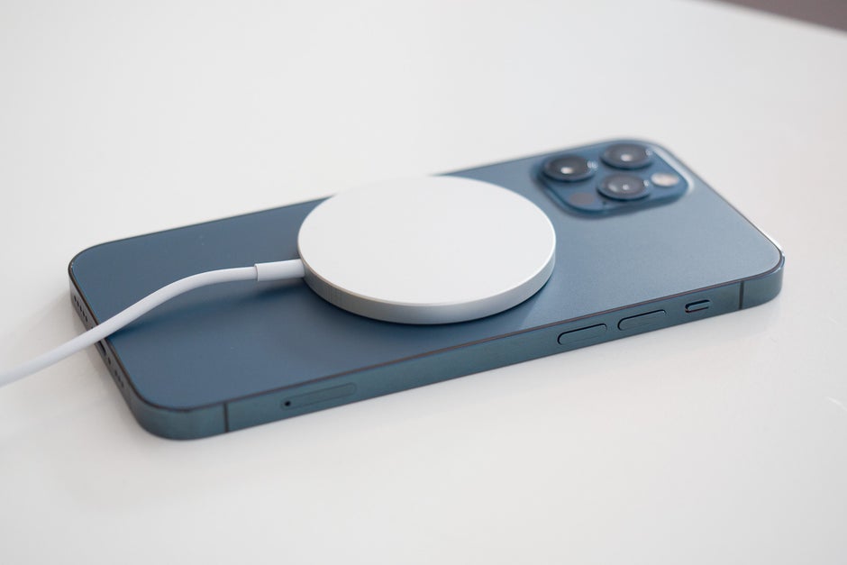 The iPhone 12 charging wirelessly with a MagSafe charger